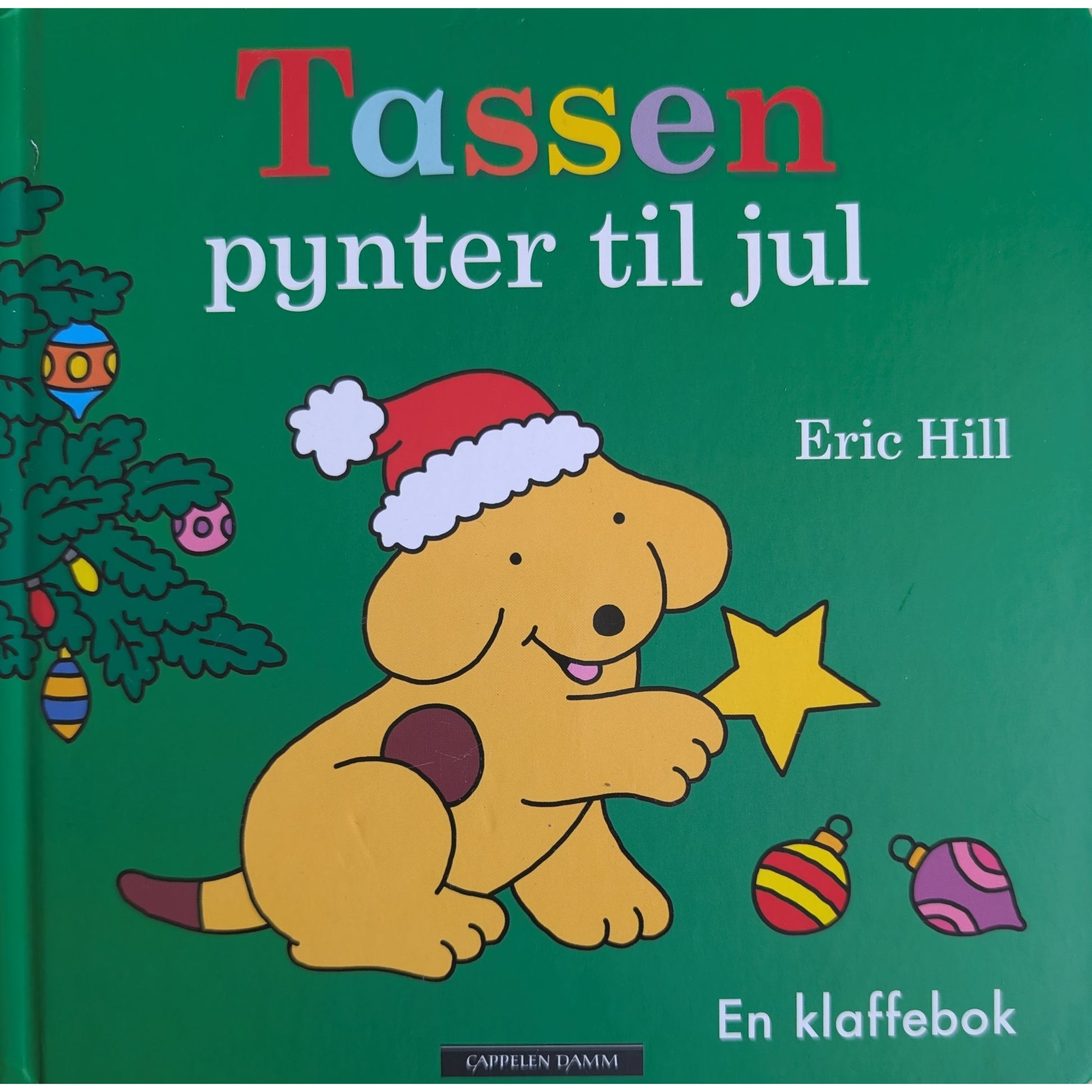 Tassen pynter til jul, brukte bøker av Eric Hill. Kartonert klaffebok